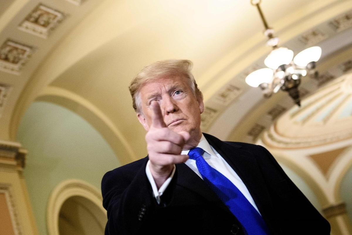US President Donald Trump speaks to reporters before a meeting with Senate Republicans on Capitol Hill March 26  2019  in Washington  DC   Photo by Brendan Smialowski   AFP