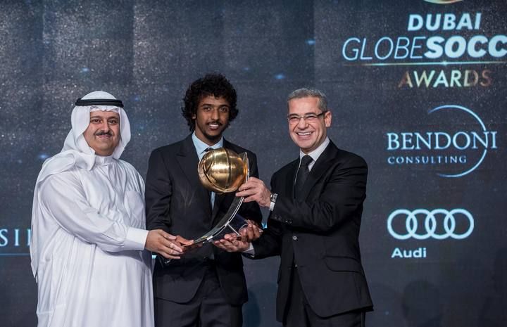 Saudi Arabia's soccer player Yasir Al-Shahrani receives the "Best GCC Player of the Year" award during the Globe Soccer Awards Ceremony at the Dubai International Sports Conference, in Dubai