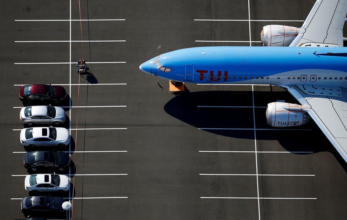 FILE PHOTO: A grounded TUI Airways Boeing 737 MAX aircraft is seen parked at a Boeing employee parking lot in an aerial photo at Boeing Field in Seattle, Washington, U.S. July 1, 2019. Picture taken July 1, 2019.  REUTERS/Lindsey Wasson/File Photo