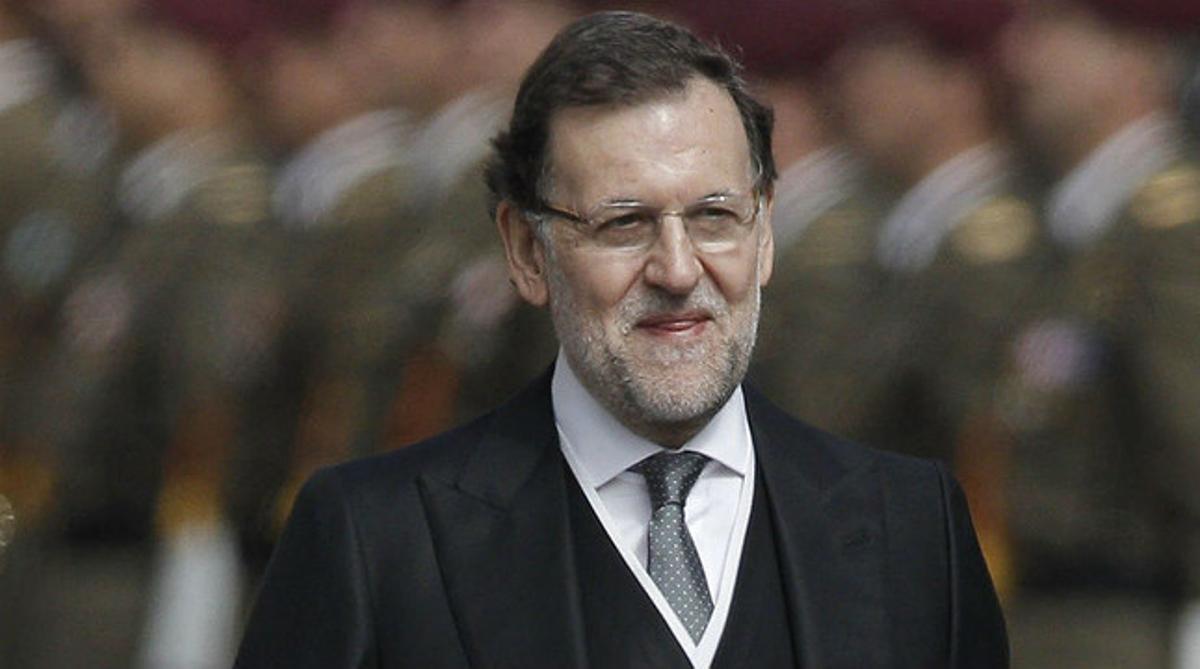 El president del Govern, Mariano Rajoy, segueix la comitiva dels nous Reis, després de la proclamació de Felip VI, aquest dijous.