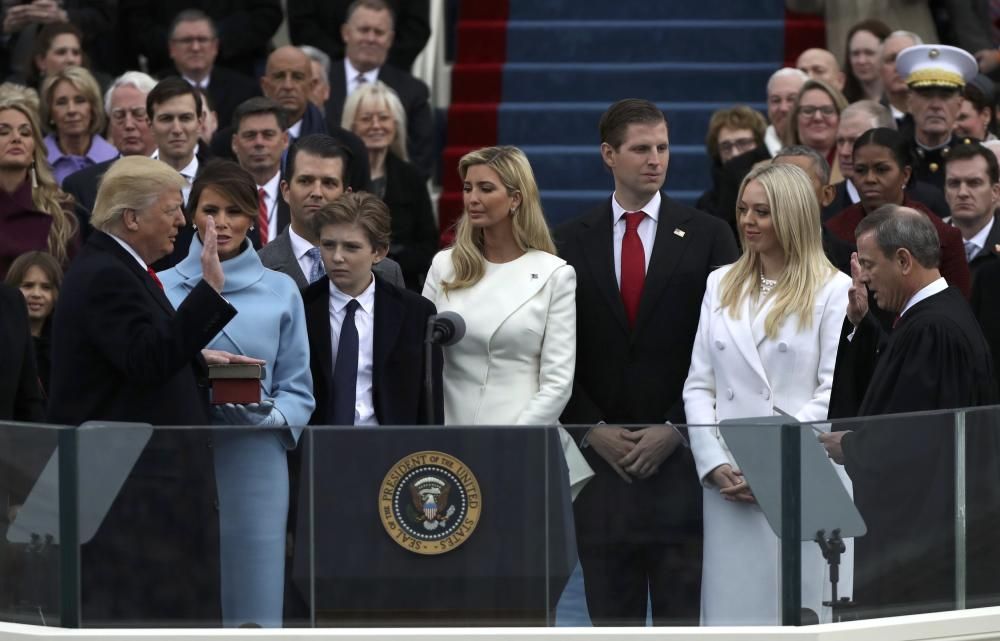 U.S. President Donald Trump takes the oath of ...