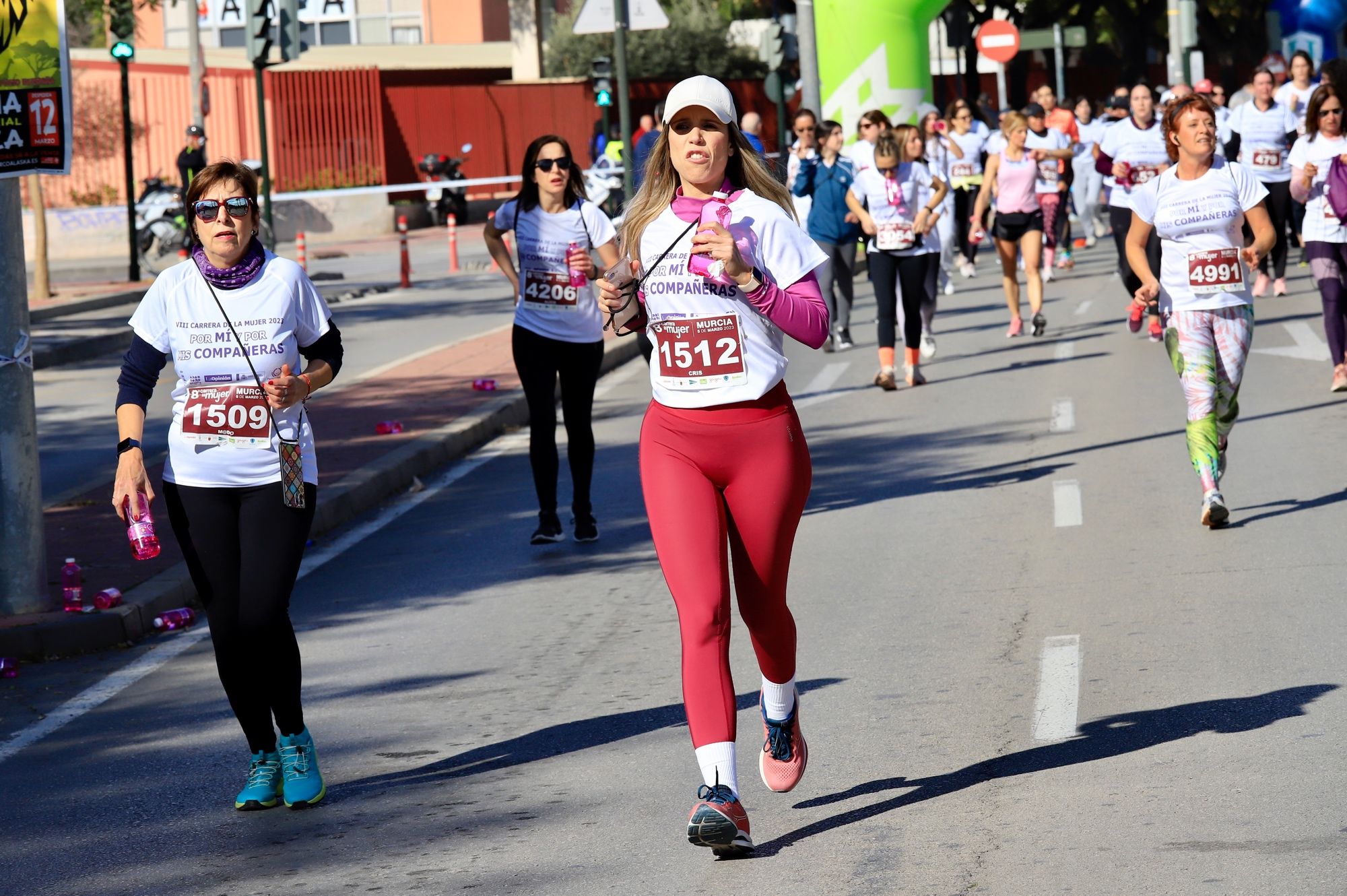 La salida y el recorrido de la Carrera de la Mujer 'inmortalizados' en imágenes