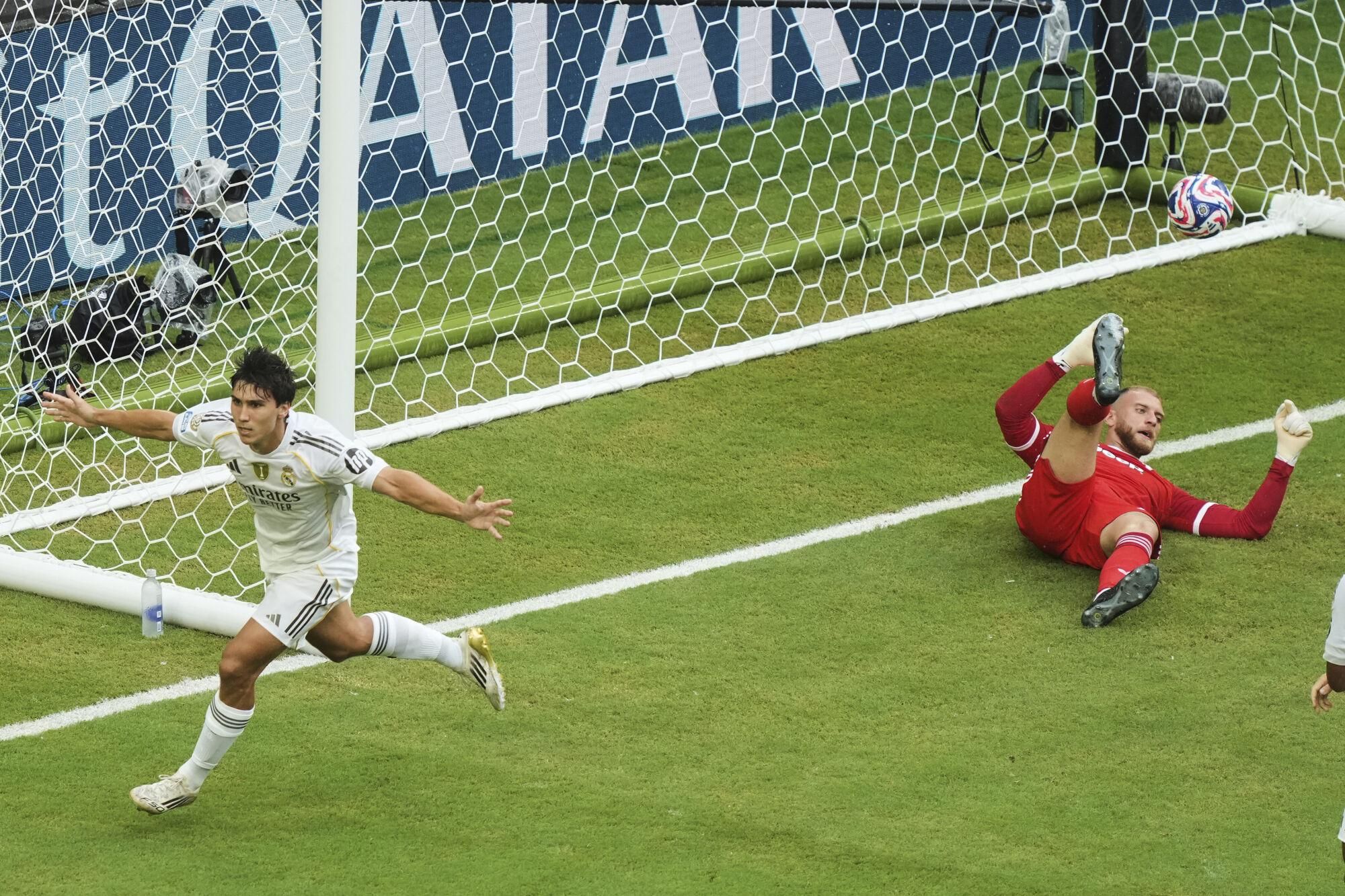 Real Madrid's Gonzalo Garcia (30) celebrates after scoring his side's opening goal during the Club World Cup round of 16 soccer match between Real Madrid and Juventus in Miami Gardens, Fla., Tuesday, July 1, 2025. (AP Photo/Marta Lavandier). EDITORIAL USE ONLY/ONLY ITALY AND SPAIN