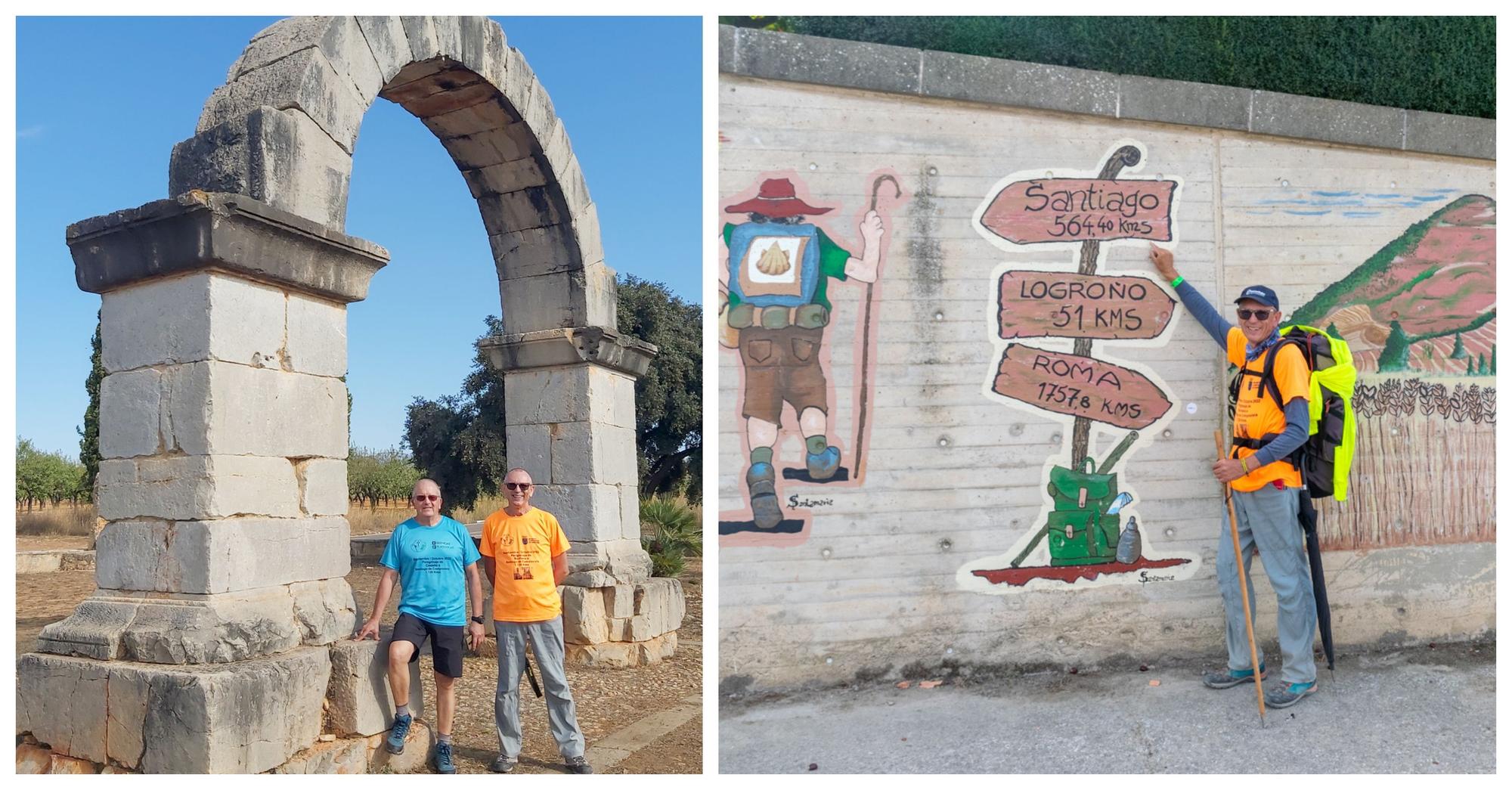 Los dos caminantes, en el Arco de Cabanes. A la derecha, Juan Carlos señalando los 564,4 kilómetros que les restaban hasta la meta.