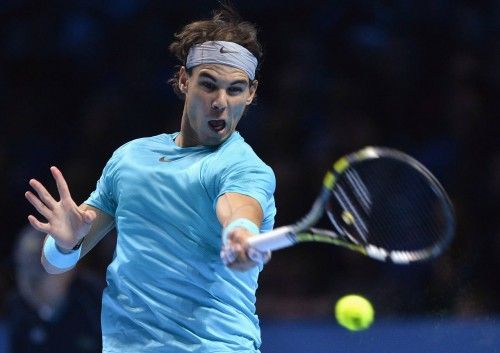 Nadal returns to Federer during his men's singles tennis match at the ATP World Tour Finals in London
