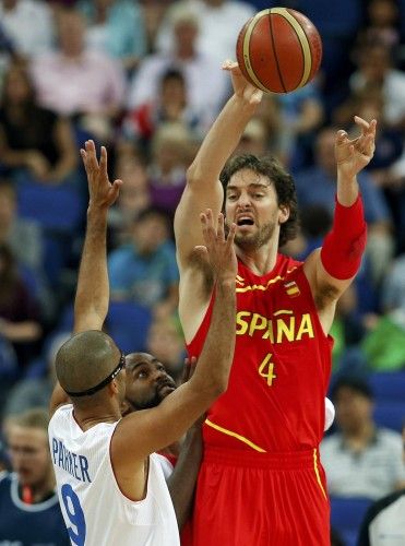Spain's Gasol makes a pass over France's Parker during their men's quarterfinal basketball match at the North Greenwich Arena in London during the London 2012 Olympic Games