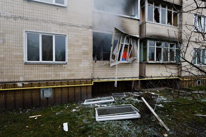 A residential building is damaged, after Russia launched a massive military operation against Ukraine, in Kyiv