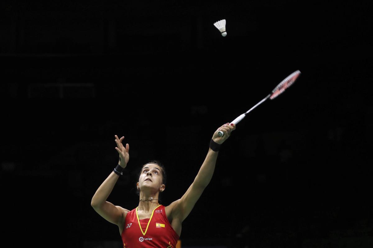 Carolina Marin of Spain plays a shot as she competes against Saina Nehwal of India in their women’s badminton singles quarterfinal match at the BWF World Championships in Nanjing, China, Friday, Aug. 3, 2018. (AP Photo/Mark Schiefelbein)