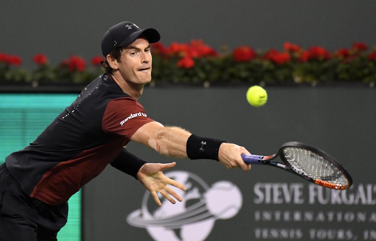 FILE - In this Saturday, March 11, 2017 file photo, Andy Murray, of Great Britain, returns a shot to Vasek Pospisil, of Canada, at the BNP Paribas Open tennis tournament in Indian Wells, Calif. Needing to make up for lost time before the French Open, Andy Murray decided at the last minute to squeeze in another clay-court tournament in Barcelona. The top-ranked Murray was going to pass on the Barcelona Open until he bowed out at Monte Carlo in the third round on Thursday, when he blew a 4-0 lead in the deciding set to Albert Ramos-Vinolas.(AP Photo/Mark J. Terrill, file)