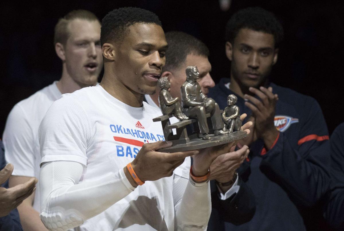 OKLAHOMA CITY, OK - APRIL 12: Russell Westbrook of the Oklahoma City Thunder receives the trophy for breaking former NBA great Oscar Robertson's triple-double record during the first half of a NBA game against the Denver Nuggets at the Chesapeake Energy Arena on April 12, 2017 in Oklahoma City, Oklahoma. NOTE TO USER: User expressly acknowledges and agrees that, by downloading and or using this photograph, User is consenting to the terms and conditions of the Getty Images License Agreement. J Pat Carter/Getty Images/AFP== FOR NEWSPAPERS, INTERNET, TELCOS &amp; TELEVISION USE ONLY ==. HORIZONTAL
