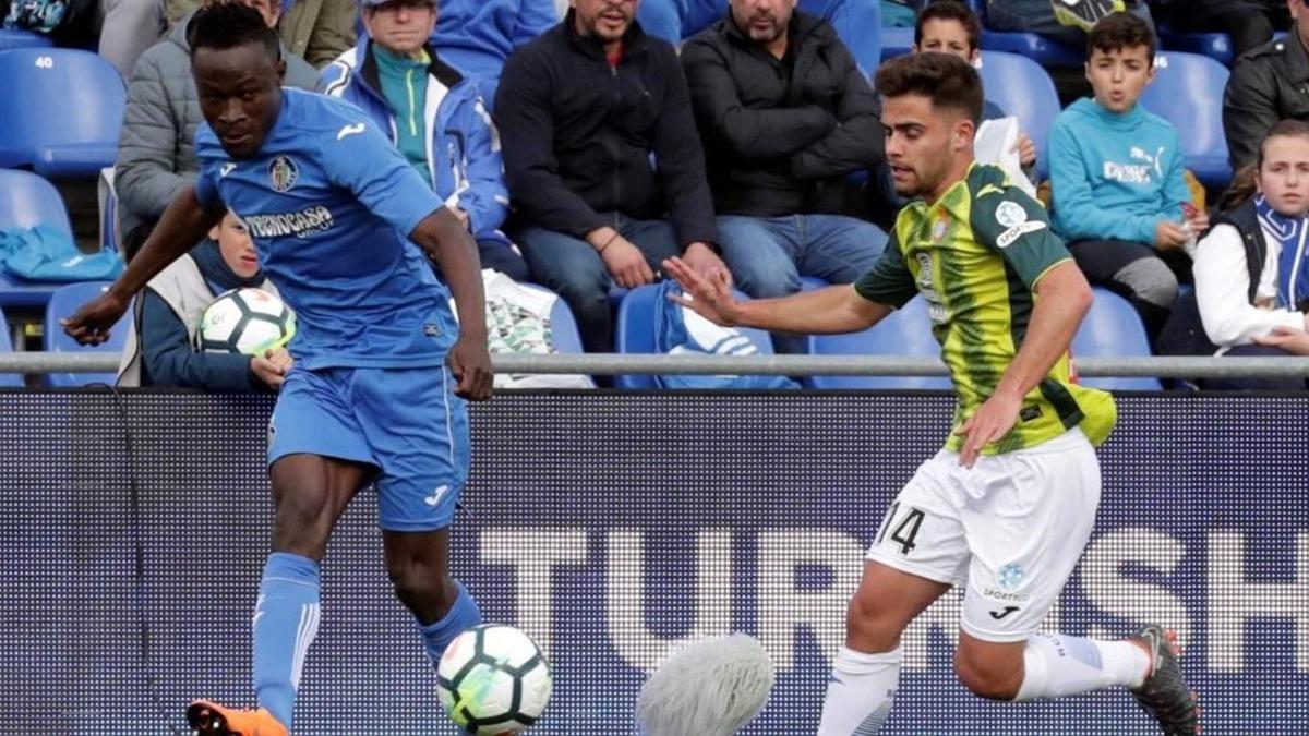 Djené y Melendo en una acción del partido en Getafe.