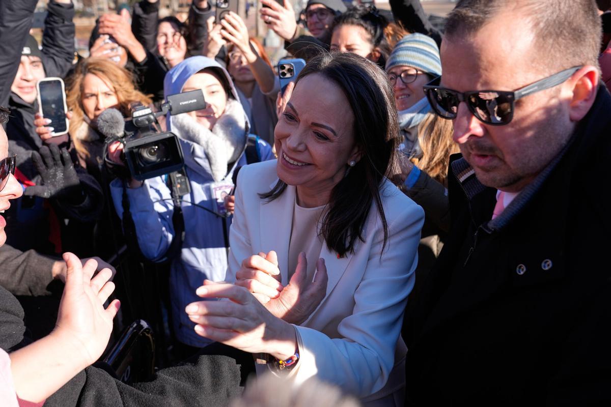 Venezuelan opposition leader María Corina Machado greets supporters on Pennsylvania Avenue near the White House after meeting with President Donald Trump Thursday, Jan. 15, 2026, in Washington. (AP Photo/Pablo Martinez Monsivais)