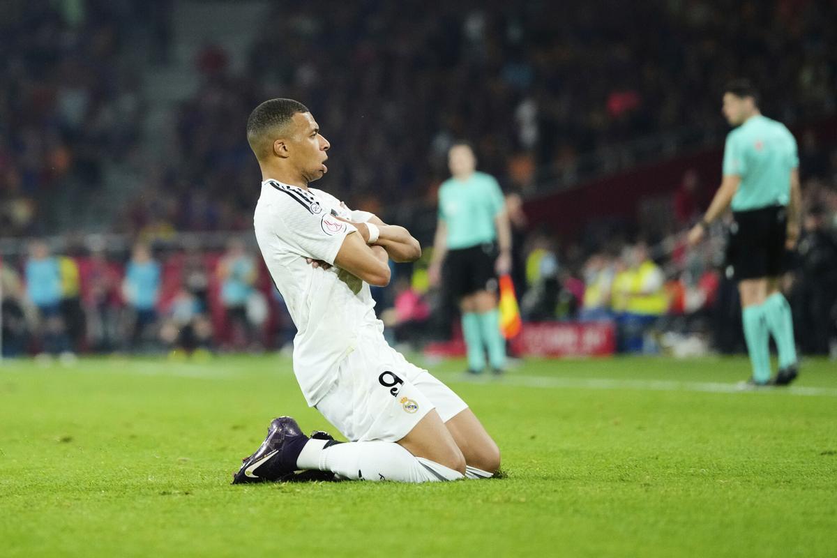 Real Madrid's Kylian Mbappe celebrates after scoring his side's opening goal during the Spanish Copa del Rey final soccer match between Barcelona and Real Madrid at Estadio de La Cartuja stadium in Seville, Spain, Saturday, April 26, 2025. (AP Photo/Jose Breton)