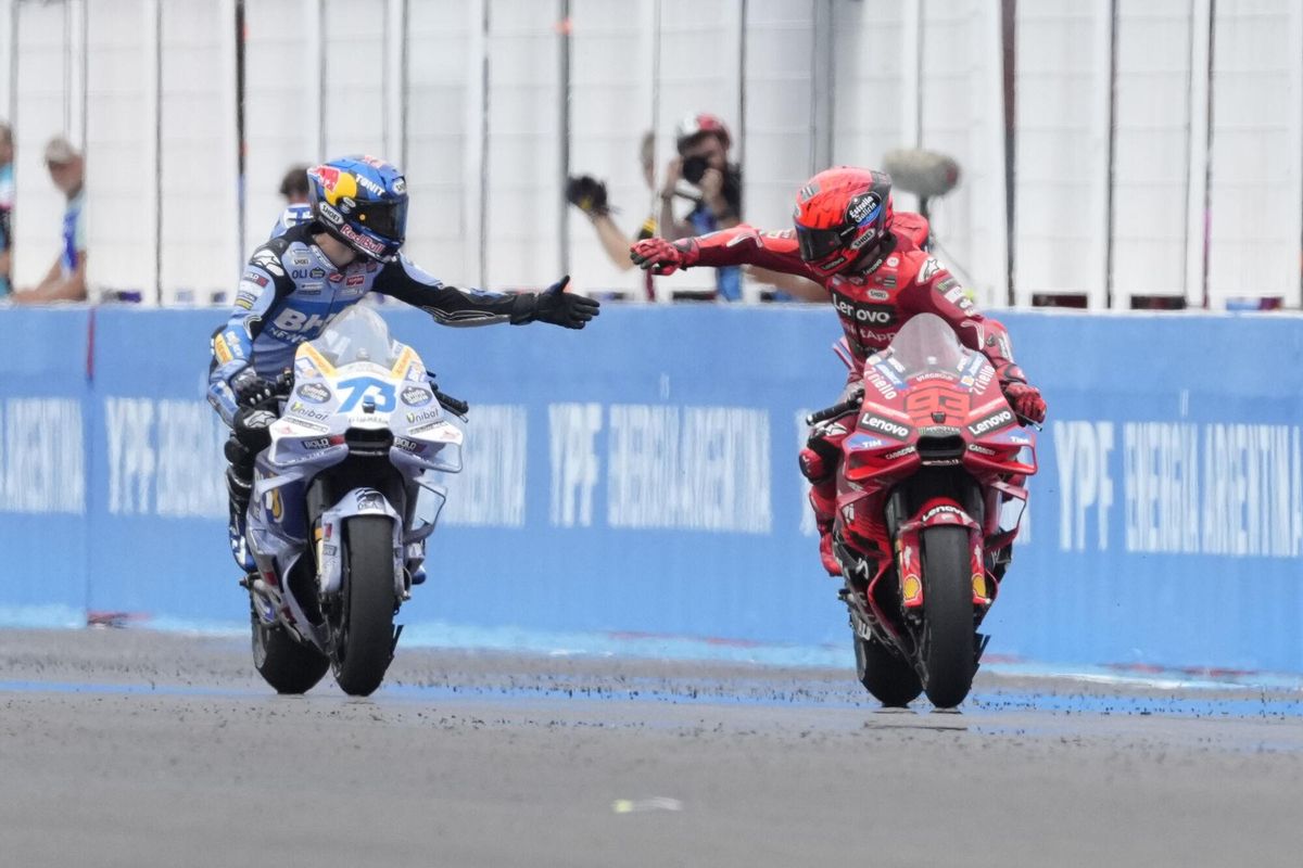 MotoGP race winner Spains Marc Marquez of the Ducati Lenovo Team, right, celebrates with second place Spains Alex Marquez of the BK8 Gresini Racing MotoGP Team in Termas de Rio Hondo circuit, Argentina, Sunday, March 16, 2025. (AP Photo/Gustavo Garello)