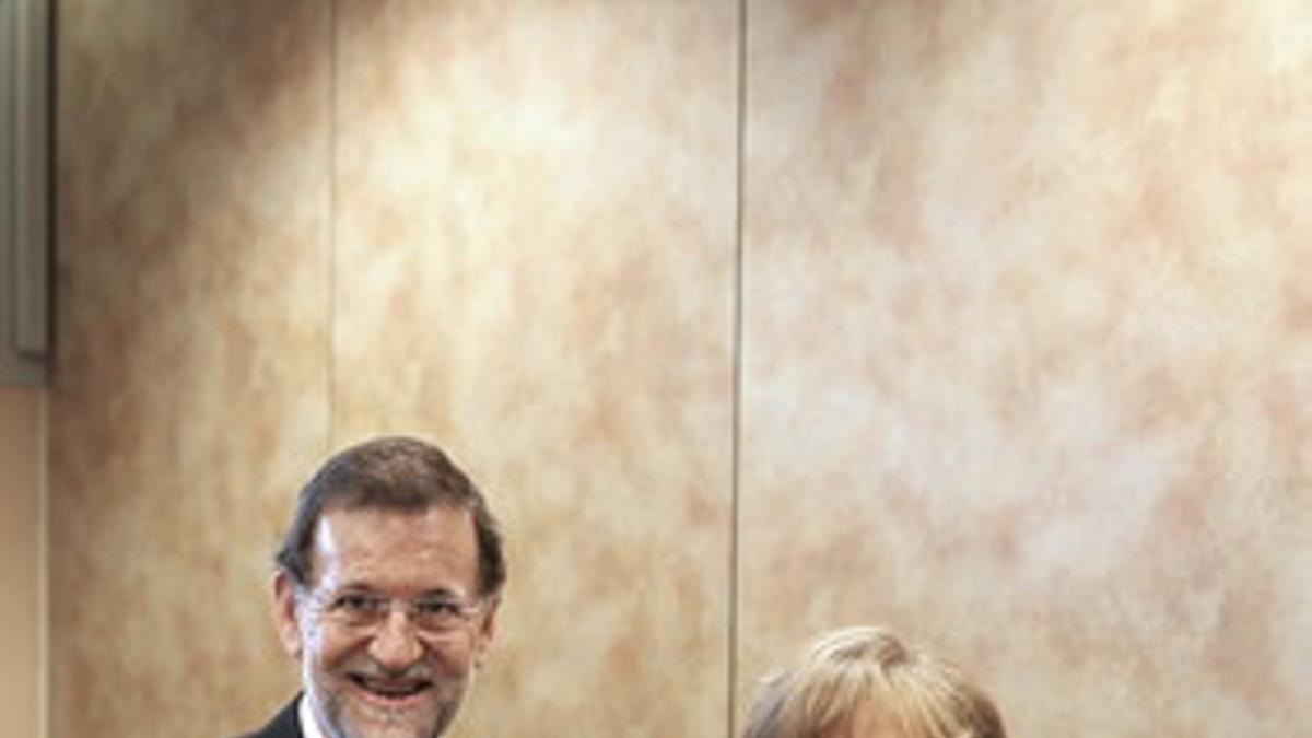 Mariano Rajoy y Angela Merkel, el pasado diciembre en Marsella, durante la cumbre del Partido Popular Europeo.