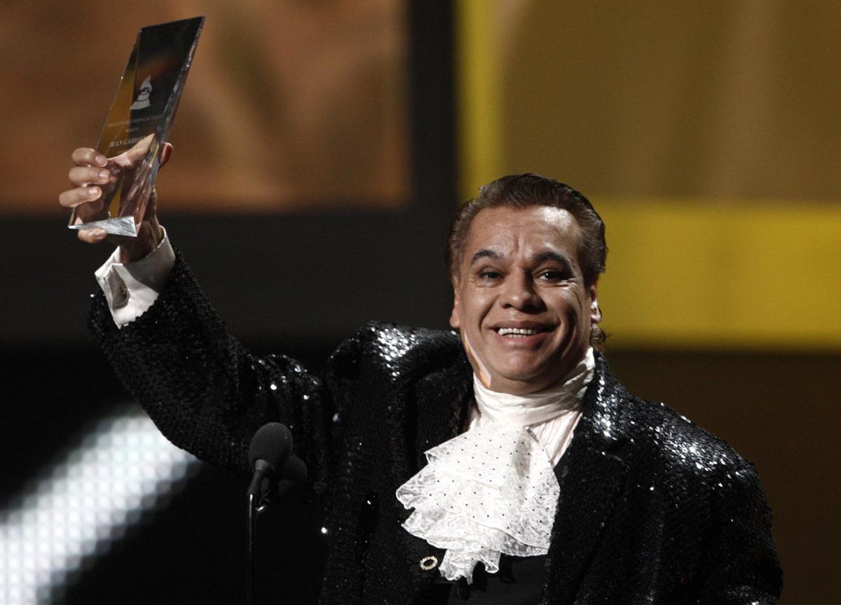FILE - In this Nov. 5, 2009, file photo, Mexican singer Juan Gabriel accepts the person of the year award at the 10th Annual Latin Grammy Awards in Las Vegas. Representatives of Juan Gabriel have reported Sunday, Aug. 28, 2016, that he has died. Gabriel was Mexico’s leading singer-songwriter and top-selling artist with sales of more than 100 million albums. The statement says he died Sunday, but did not say where. (AP Photo/Matt Sayles, File)