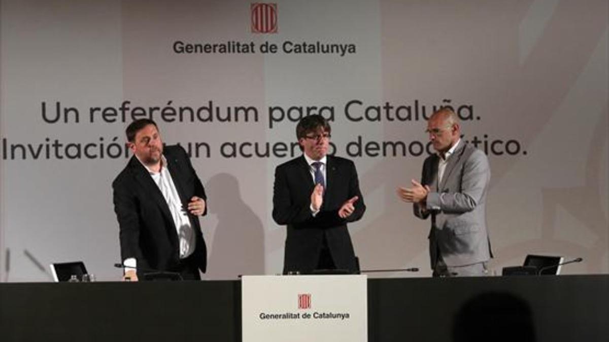 Junqueras, Puigdemont y Romeva, ayer, en la conferencia de Madrid.