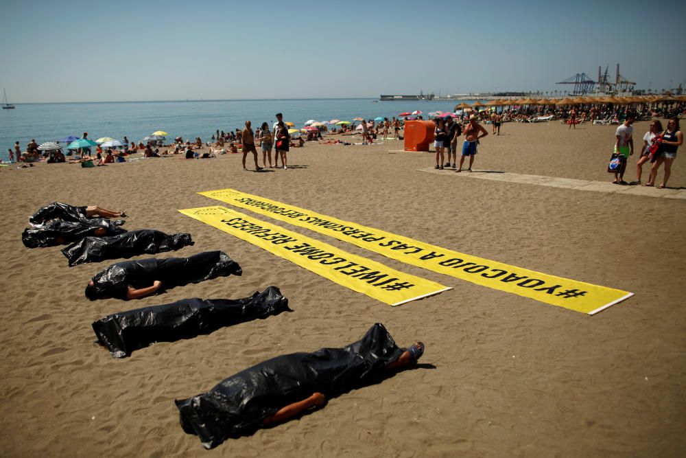 People take part in a performance which ...