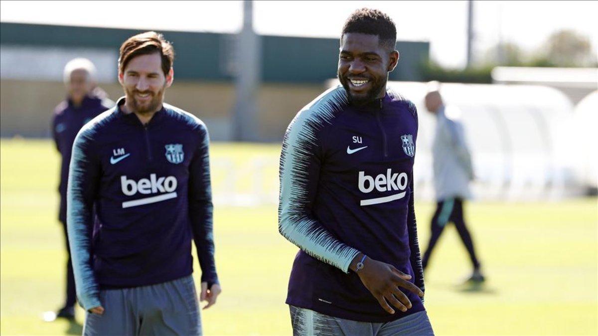 Umtiti y Messi, en el entrenamiento del Barça