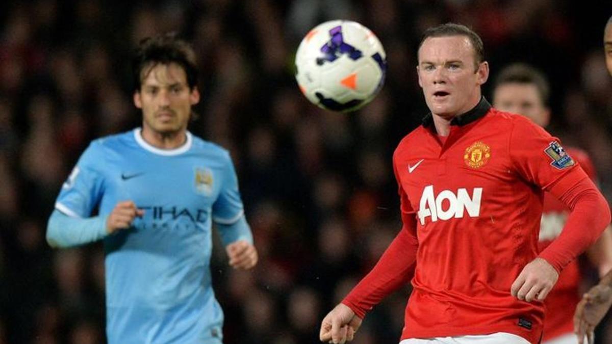 Silva y Rooney, durante un derbi de Manchester