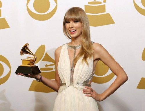Taylor Swift holds the award for Best Song Written For Visual Media at the 55th annual Grammy Awards in Los Angeles