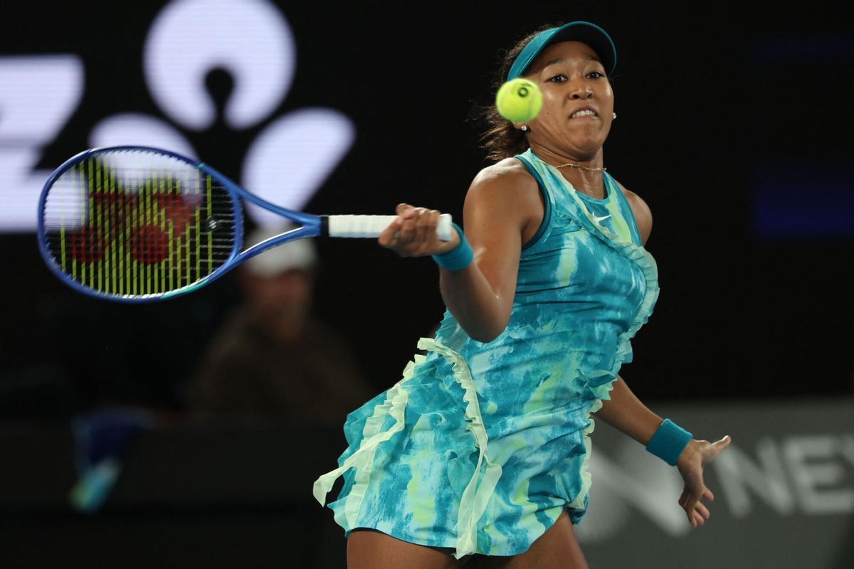 Japan's Naomi Osaka hits a shot against Croatia’s Antonia Ruzic during their women's singles match on day three of the Australian Open tennis tournament in Melbourne on January 20, 2026. (Photo by IZHAR KHAN / AFP) / -- IMAGE RESTRICTED TO EDITORIAL USE - STRICTLY NO COMMERCIAL USE --. -- IMAGE RESTRICTED TO EDITORIAL USE - STRICTLY NO COMMERCIAL USE --