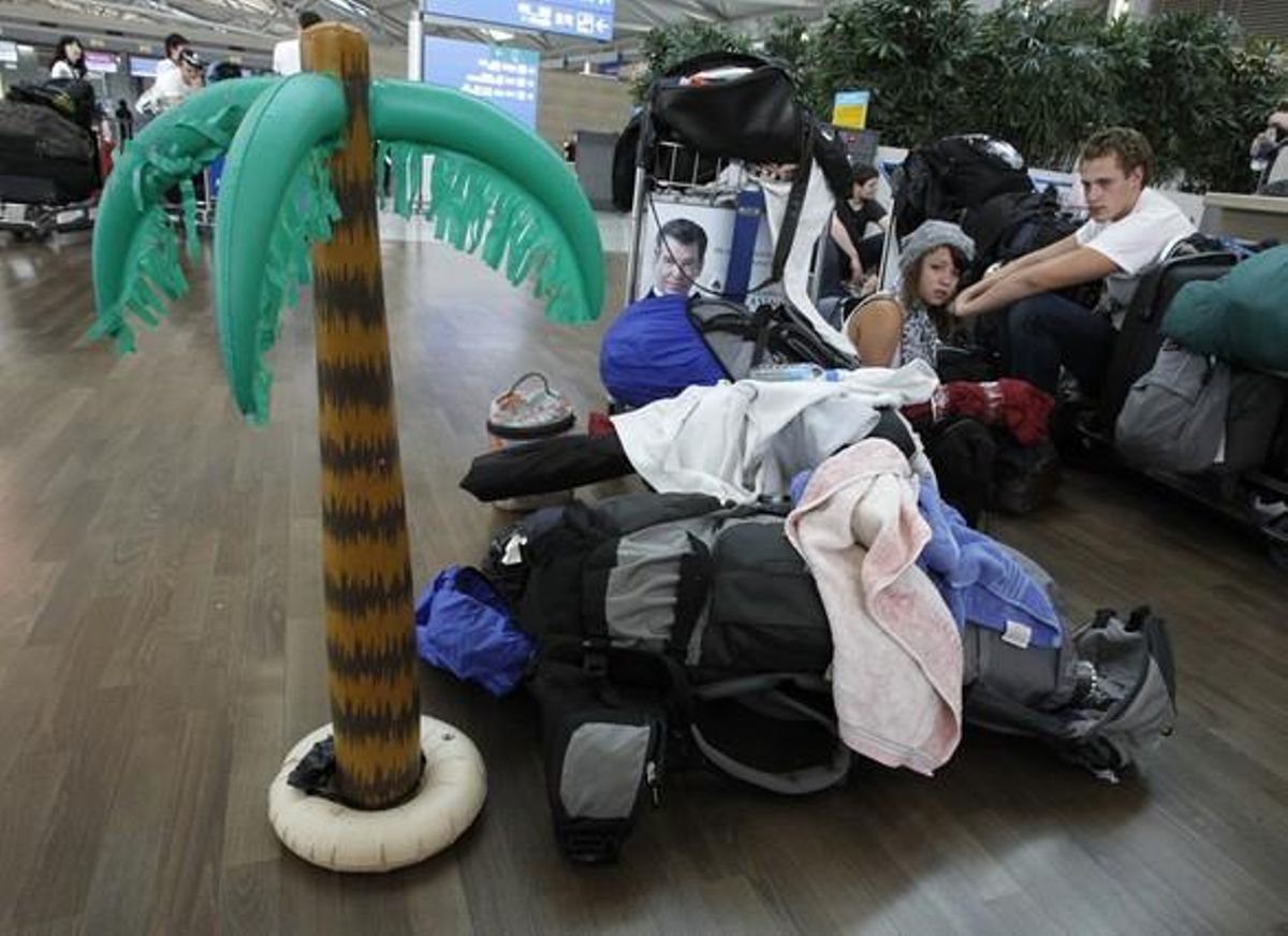 Passengers wait for their flight to Frankfurt in the departure terminal of Inchon International Airport