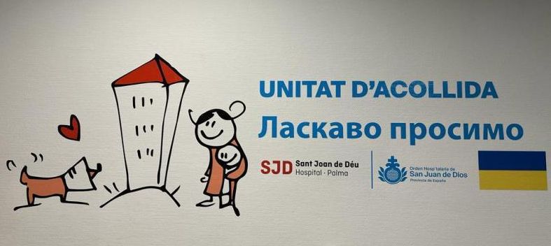 Cartel ya colocado en el Sant Joan de Déu para hacer más cálida la acogida de los refugiados