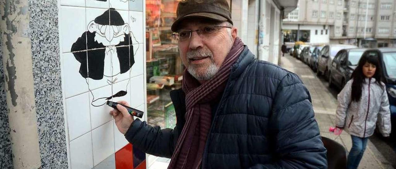 Gogue dibujando a Floreano en la fachada de la librería. // Rafa Vázquez