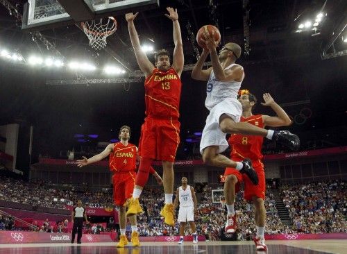France's Parker is guarded by Spain's Gasol during their men's quarterfinal basketball match at the North Greenwich Arena in London during the London 2012 Olympic Games