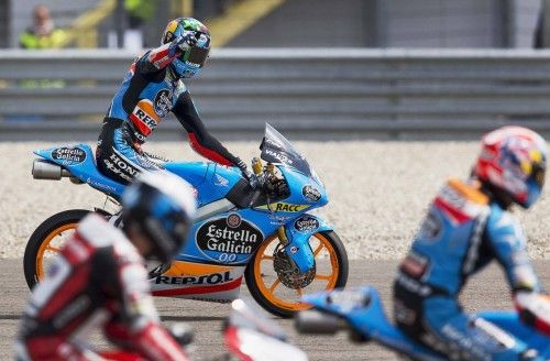 Honda Moto3 rider Marquez of Spain celebrates on bike after winning Dutch Grand Prix in Assen
