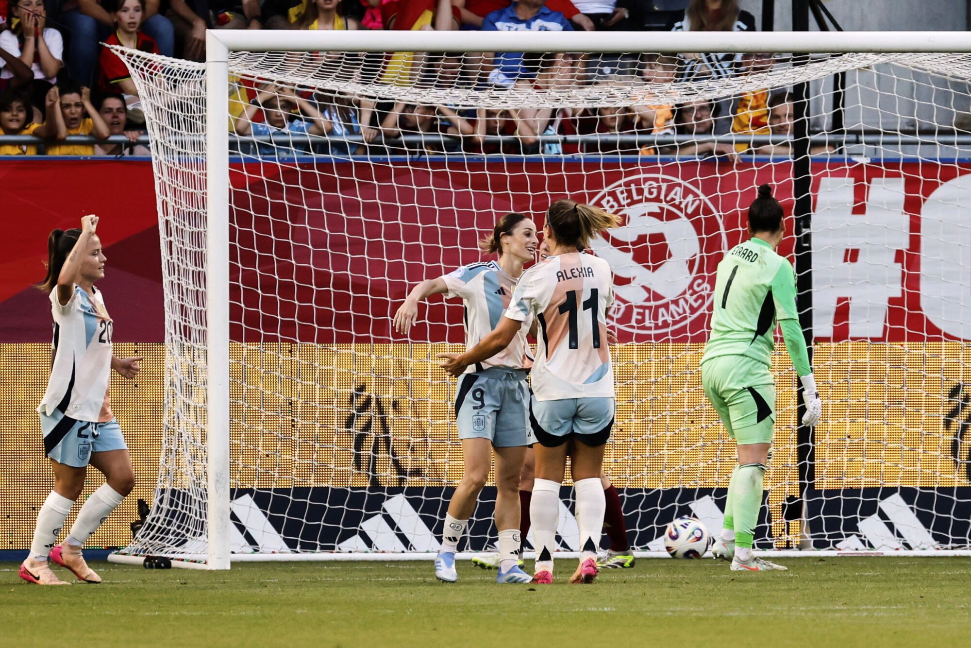 Spain's Esther Gonzalez, center left, celebrates after scoring the opening goal during the League A group A3 Women's Nations League soccer match between Belgium and Spain at Den Dreef Stadium in Leuven, Belgium, Friday, May 30, 2025. (AP Photo/Geert Vanden Wijngaert)