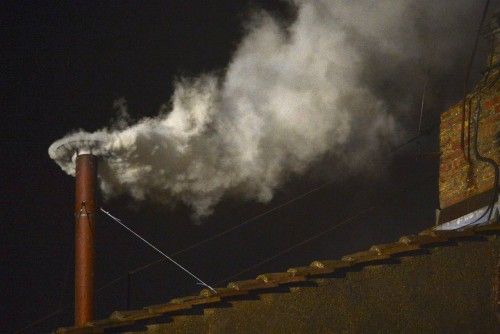 White smoke rises from the chimney on the Sistine Chapel indicating that a new pope has been elected at the Vatican