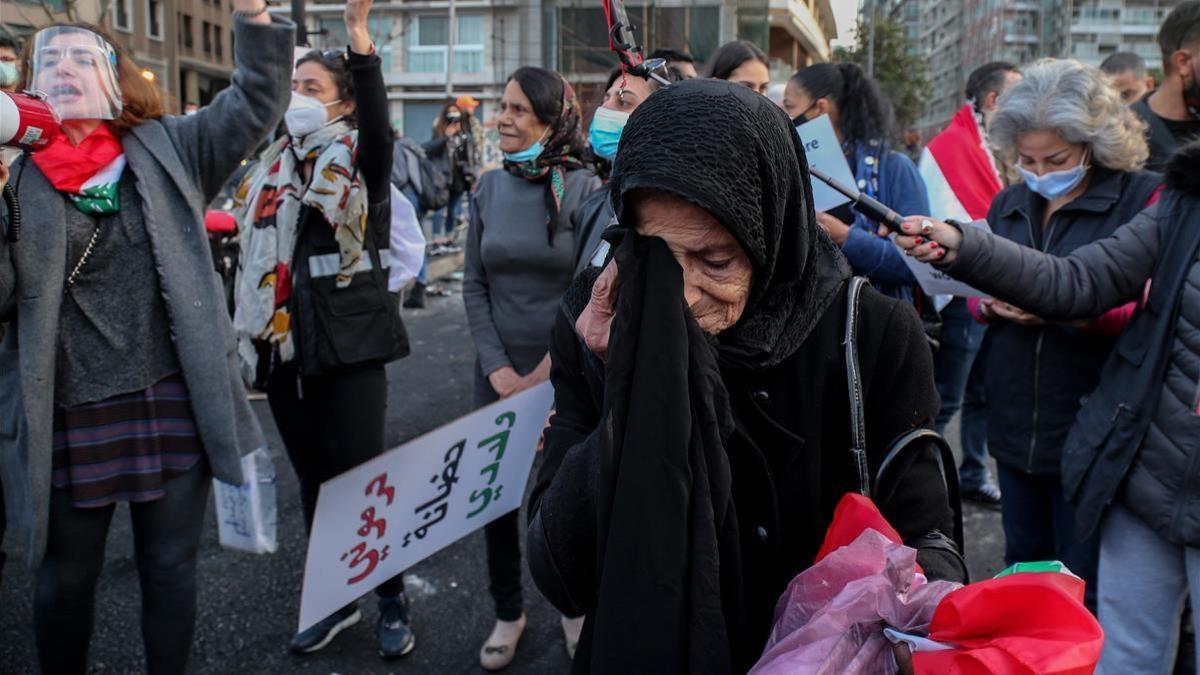 Beirut (Lebanon)  08 03 2021 - An elderly woman takes part in a march to mark the International Women s Day  in Beirut  Lebanon  08 March 2021  Dozens of Lebanese activists joined a march to commemorate the International Women s Day  (Libano) EFE EPA NABIL MOUNZER