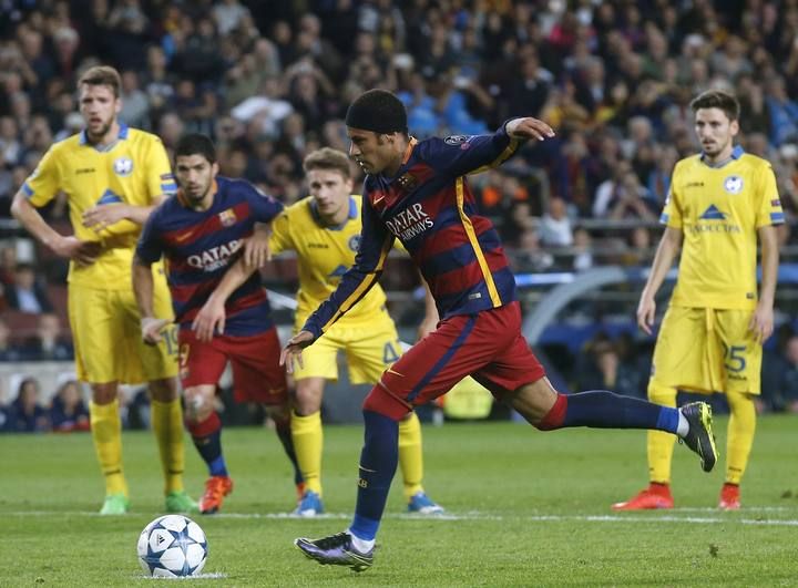 Barcelona's Neymar scores a penalty against Bate Borisov during their Champions League soccer match at Camp Nou stadium in Barcelona