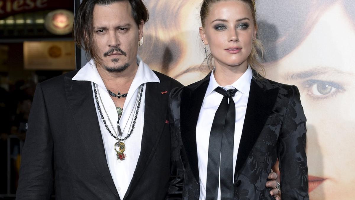 Cast member Amber Heard and husband Johnny Depp pose during the premiere of the film &quot;The Danish Girl,&quot; in Los Angeles