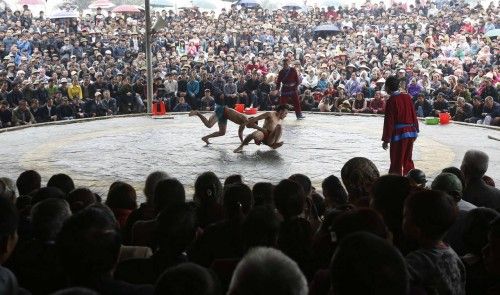 Villagers watch a wrestling match during Chua Nanh festival in Ninh Hiep village, outside Hanoi