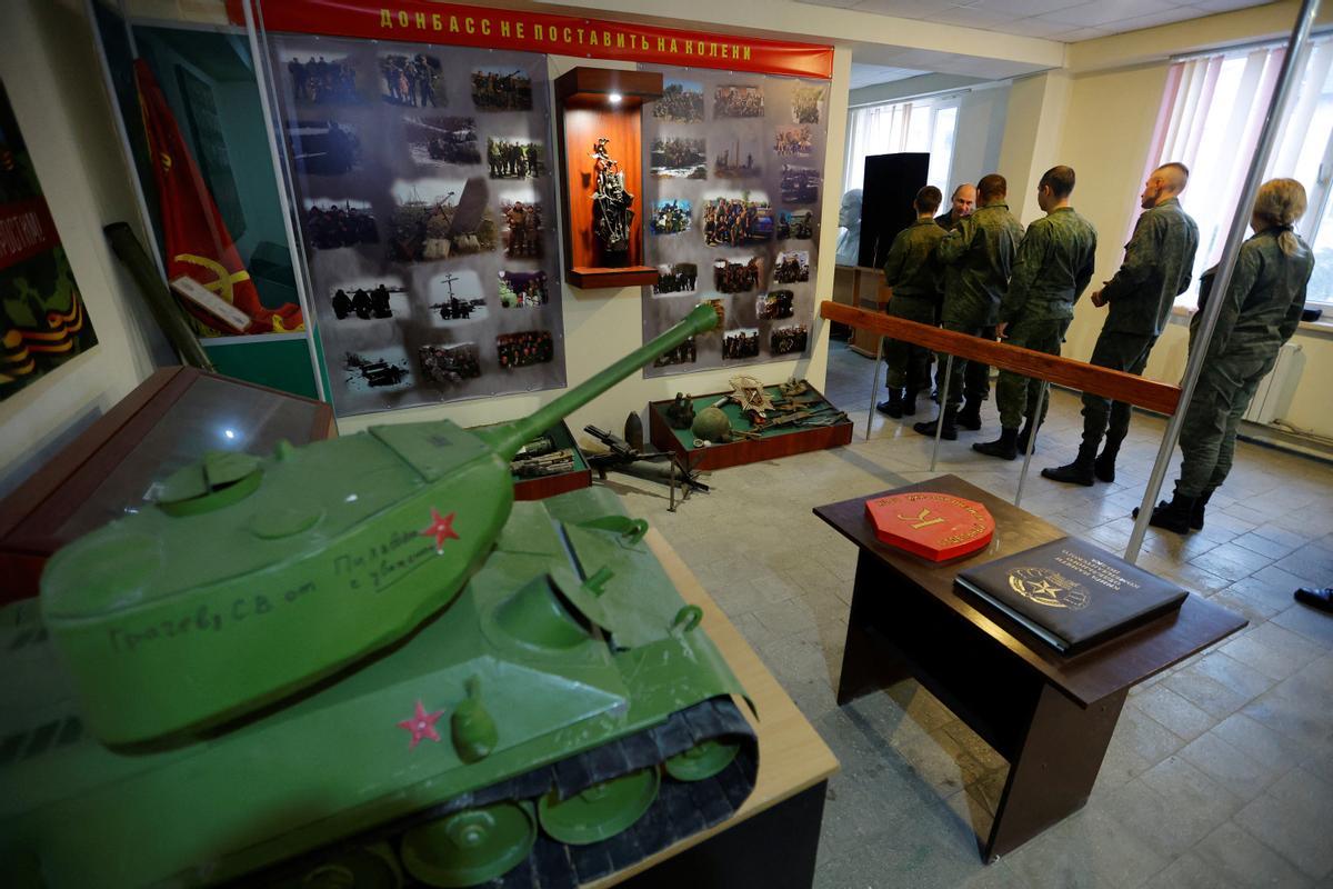 Service members of the self-proclaimed Luhansk Peoples Republic vote during a referendum in Luhansk