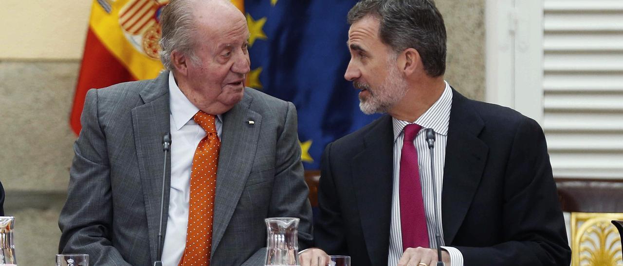 Juan Carlos I y su hijo Felipe VI.