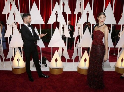 Singer Adam Levine and his wife Behati Prinsloo arrive at the 87th Academy Awards in Hollywood, California