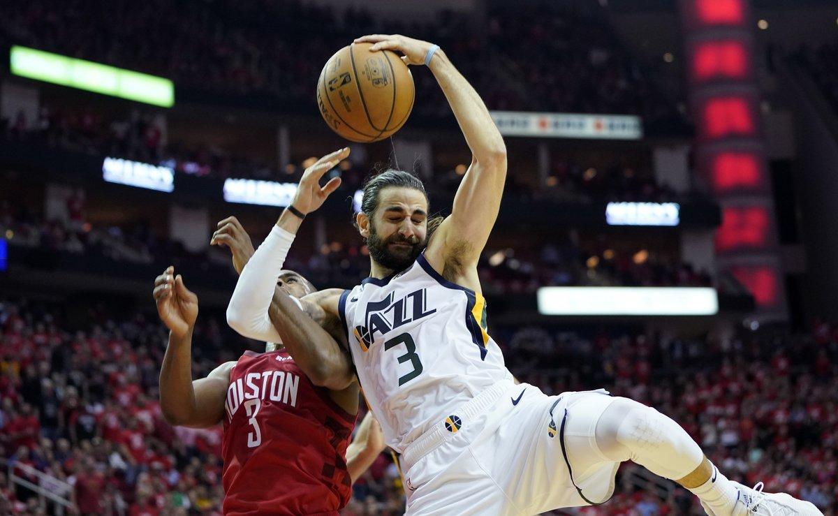 Utah Jazz guard Ricky Rubio, right, is fouled by Houston Rockets guard Chris Paul, left, as he drives to the basket during the second half in Game 5 of an NBA basketball playoff series, in Houston, Wednesday, April 24, 2019. (AP Photo/David J. Phillip)
