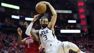 Utah Jazz guard Ricky Rubio, right, is fouled by Houston Rockets guard Chris Paul, left, as he drives to the basket during the second half in Game 5 of an NBA basketball playoff series, in Houston, Wednesday, April 24, 2019. (AP Photo/David J. Phillip)