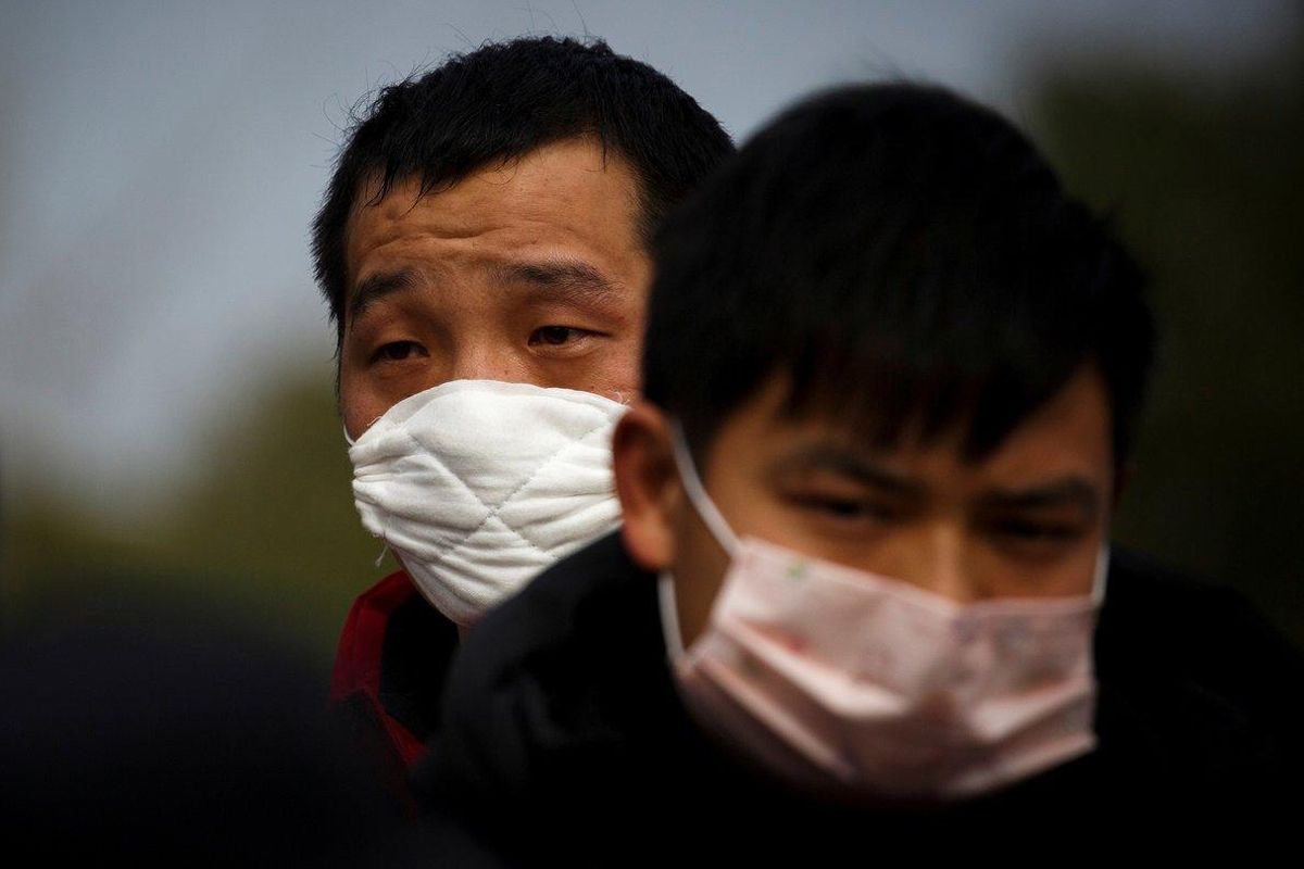 FILE PHOTO: People coming from the Hubei province wait at a checkpoint at the Jiujiang Yangtze River Bridge in Jiujiang, Jiangxi province, China, as the country is hit by an outbreak of a new coronavirus, February 1, 2020. REUTERS/Thomas Peter - RC2JRE950YUT/File Photo FILE PHOTO: People coming from the Hubei province wait at a checkpoint at the Jiujiang Yangtze River Bridge in Jiujiang, Jiangxi province, China, as the country is hit by an outbreak of a new coronavirus, February 1, 2020. REUTERS/Thomas Peter - RC2JRE950YUT/File Photo