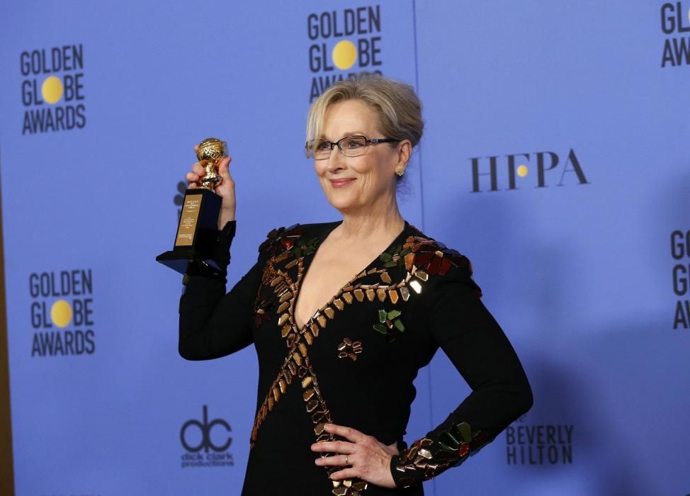 Meryl Streep holds the Cecil B. DeMille Award ...