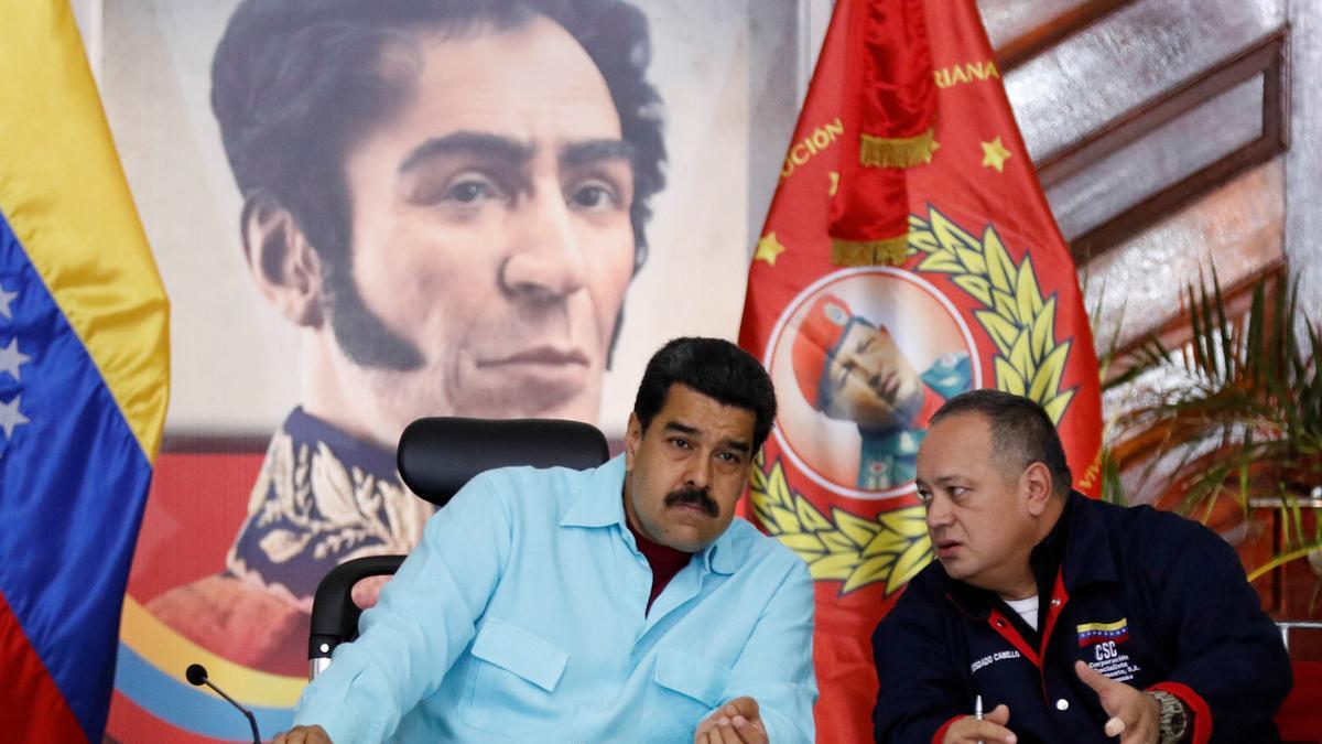 Venezuela's President Nicolas Maduro and Diosdado Cabello, deputy of Venezuela's United Socialist Party, speak during a meeting with governors and mayors in Caracas