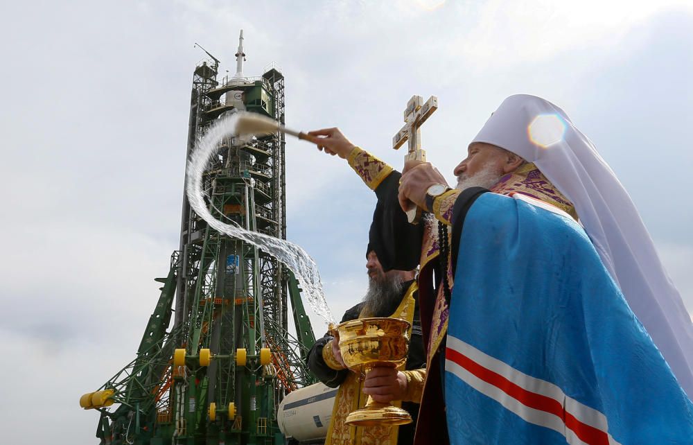 An Orthodox priest conducts a blessing in front ...