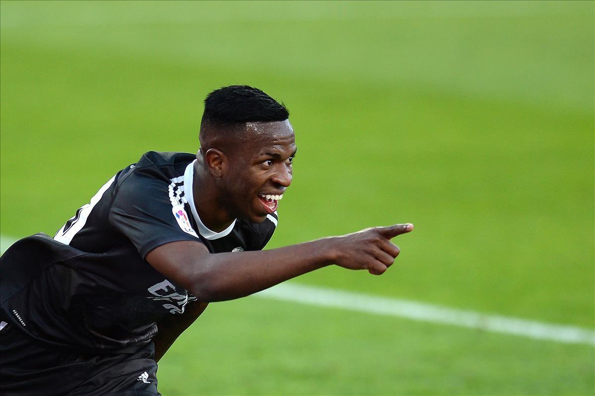 Real Madrid s Brazilian forward Vinicius Junior celebrates after scoring a goal during the Spanish League football match between Sevilla and Real Madrid at the Sanchez Pizjuan stadium in Seville on December 5  2020  (Photo by CRISTINA QUICLER   AFP)