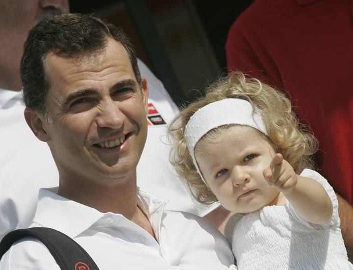 Spanish Crown Prince Felipe holds her daughter Leonor after arriving at Palma's Nautic Club during the first stage of the 26 King's cup sailing race in Mallorca