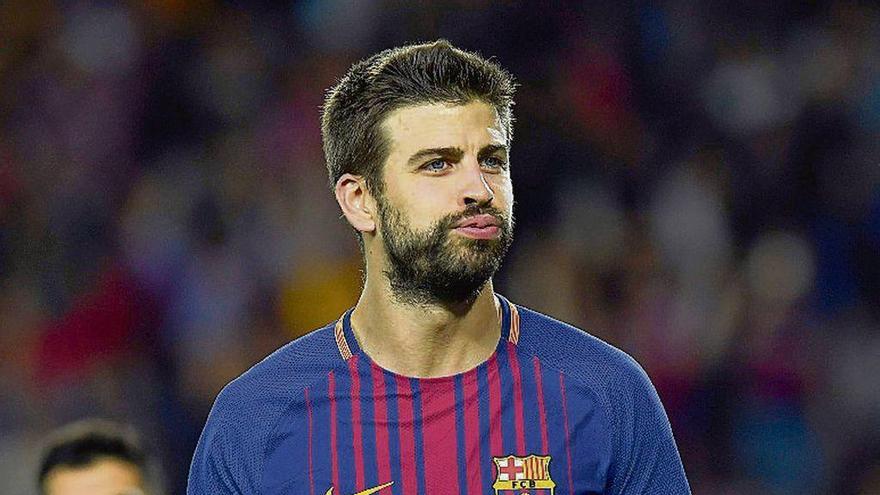 Piqué celebra un gol con el Barcelona.