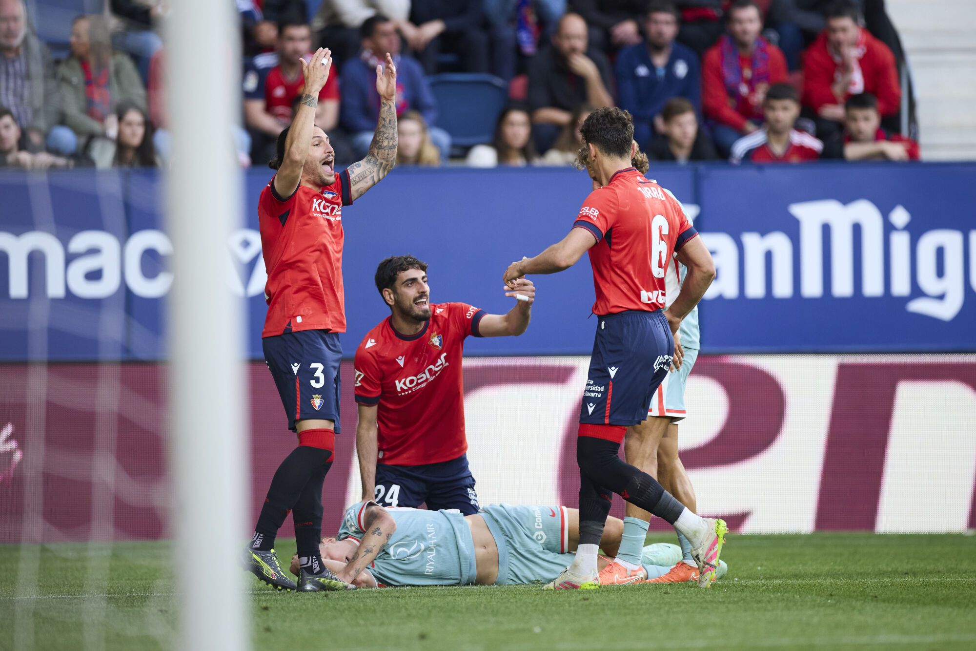 Juan Cruz and Alejandro Catena of CA Osasuna helps to Pablo Barrios of Atletico de Madrid during the LaLiga EA Sports match between CA Osasuna and Atletico de Madrid at El Sadar on May 15, 2025, in Pamplona, Spain. AFP7 15/05/2025 ONLY FOR USE IN SPAIN. Ricardo Larreina / AFP7 / Europa Press;2025;SPAIN;SPORT;ZSPORT;SOCCER;ZSOCCER;CA Osasuna v Atletico de Madrid - LaLiga EA Sports;